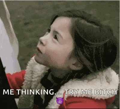 a little girl in a red jacket is looking up and saying `` me thinking try me bitch '' .