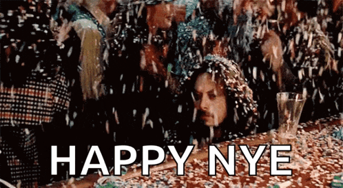 a man is surrounded by confetti and the words happy nye are written on the bottom