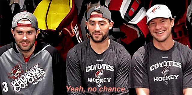 three coyotes hockey players wearing shirts that say yeah no chance