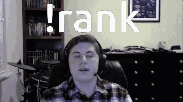 a man wearing headphones with the word rank written above him