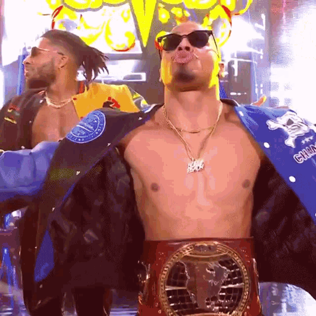 a shirtless man wearing sunglasses and a belt with the word champions on it .