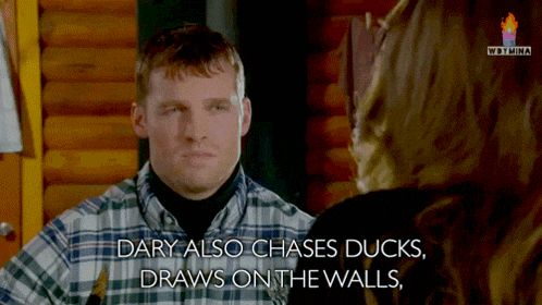 a man in a plaid shirt is talking to a woman with the words dary also chases ducks draws on the walls