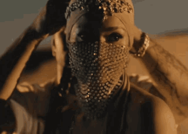 a woman with a veil on her face is being touched by another woman