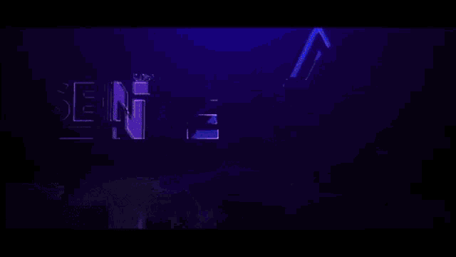 a blurred image of a stage with a blue light shining on it
