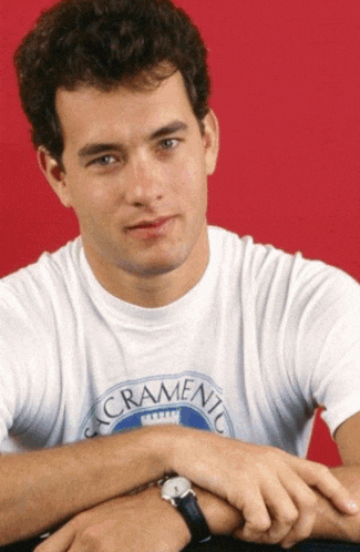 a young man wearing a sacramento t-shirt with his hands on his hips