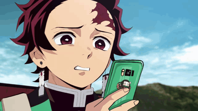 a cartoon character is holding a cell phone with a picture of nezuko on the back of it