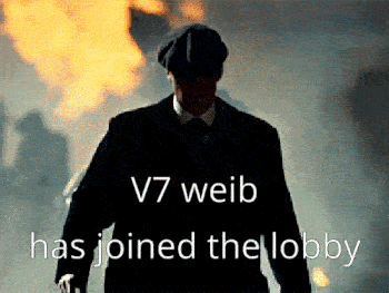 a man in a suit and hat is walking in front of a fire with the words " v7 weib has joined the lobby "