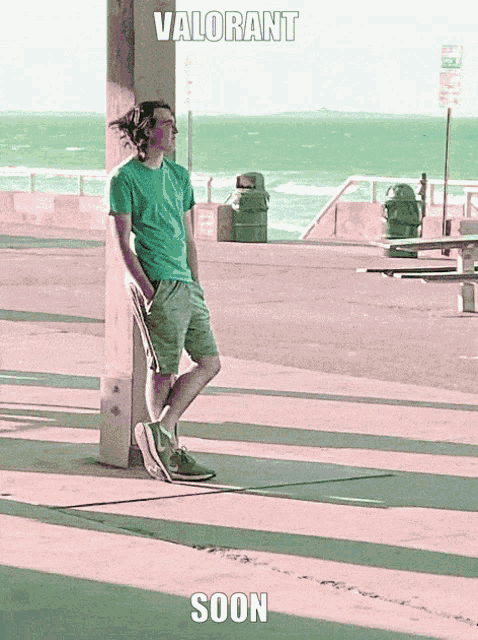 a man leaning against a pole with the words valorant soon written on the bottom
