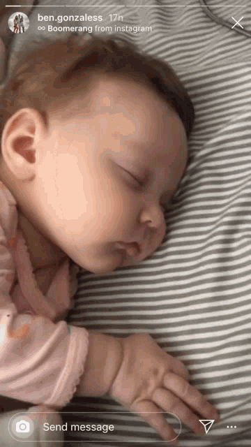 a baby is sleeping on a striped blanket with the name ben gonzaless written on the bottom