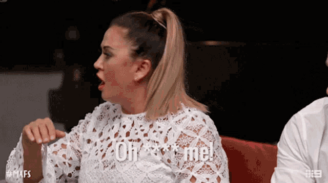 a woman in a white lace top is screaming oh *** me