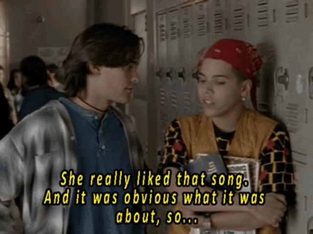 two people standing next to each other with the words she really liked that song and it was obvious what it was about
