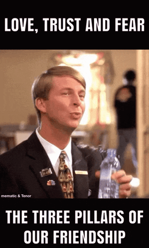 a man in a suit and tie holds a bottle of water and says love trust and fear
