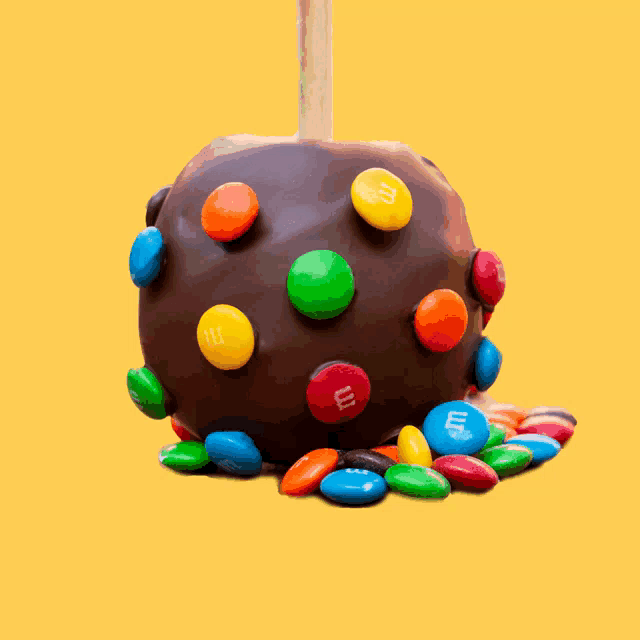 a chocolate apple with m and m 's on it