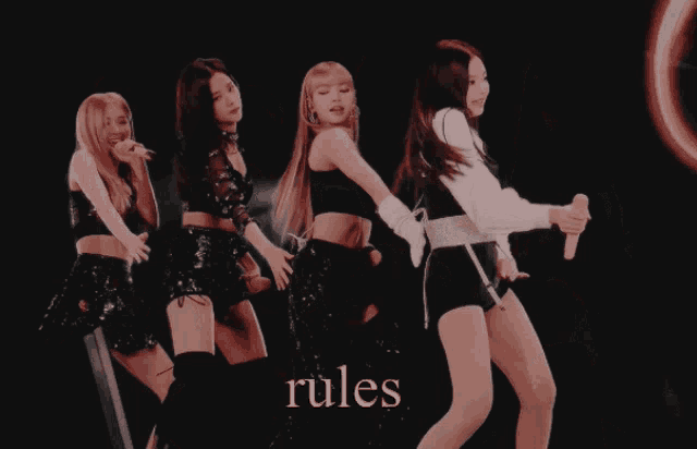 a group of girls are standing next to each other with the word rules written in pink