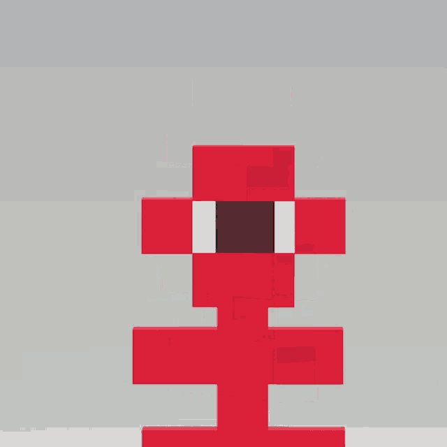 a red block with a black square in the middle of it