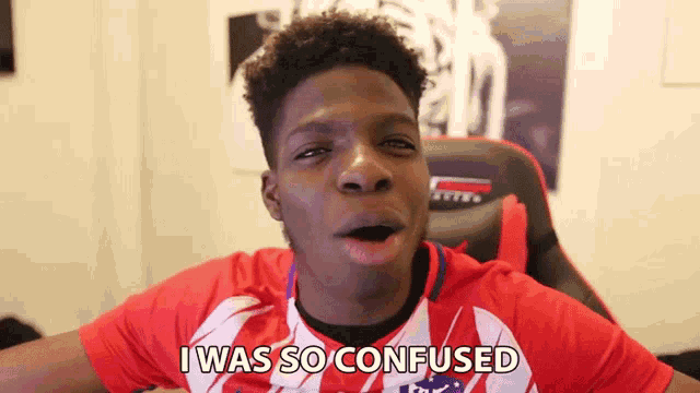 a young man in a red and white shirt is making a funny face and saying i was so confused