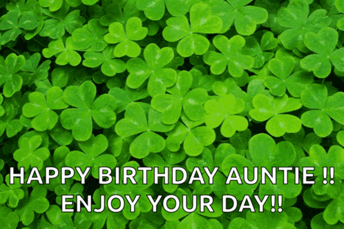 a bunch of green clovers with the words happy birthday auntie