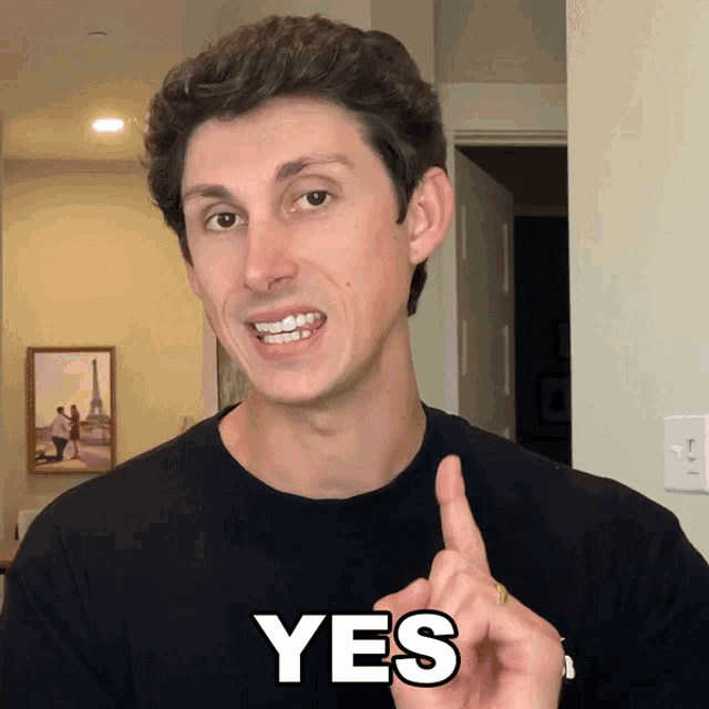 a man giving a thumbs up with the word yes above his head