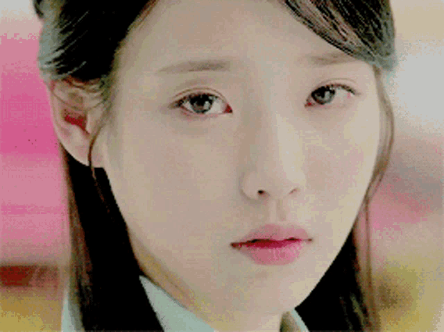 a close up of a woman 's face with pink lips
