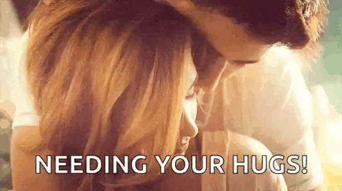 a man and a woman hugging each other with the words `` needing your hugs '' .