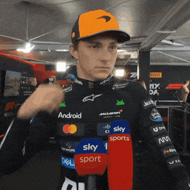 a man wearing a black shirt that says android and sky sports