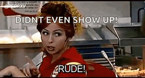 a woman in a red shirt is talking on a cell phone in a restaurant and says didnt even show up rude .