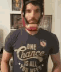 a man wearing a helmet and a t-shirt that says `` one chance is all you need ''