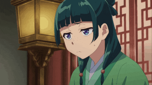 a girl with green hair and blue eyes looks angry