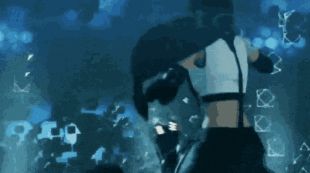 a man is carrying a woman in front of a fire explosion .