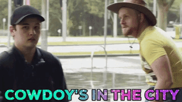 two men standing next to each other with the words " cowboy 's in the city " above them