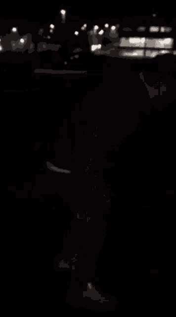 a blurry picture of a dark room with a few lights