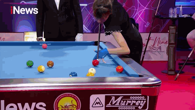 a pool table with a murrey logo on the side