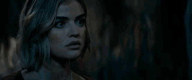 a close up of a woman 's face with the words shut up in the background