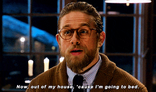 a man with glasses and a beard is saying " now out of my house cause i 'm going to bed "