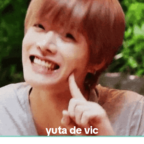 a close up of a person 's face with the words " yuta de vic " below it