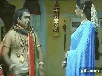 a man and a woman are talking to each other in a room .