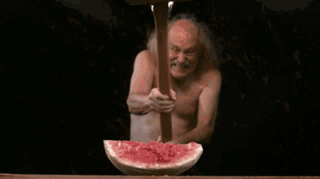 a slice of watermelon is on fire with a flame coming out of it