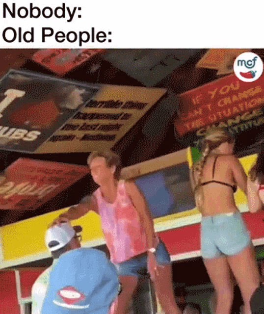 a woman in a bikini is dancing in front of a sign that says " if you can 't change the situation change yourself "