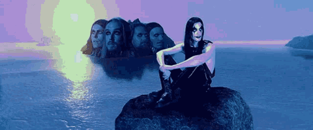 a man is sitting on a rock in front of a group of men