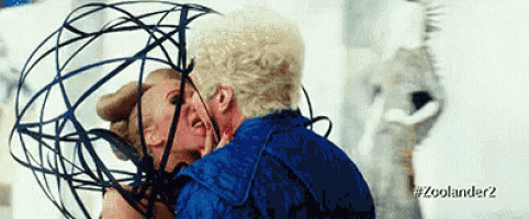 a man and a woman are kissing in a zoolander 2 scene .