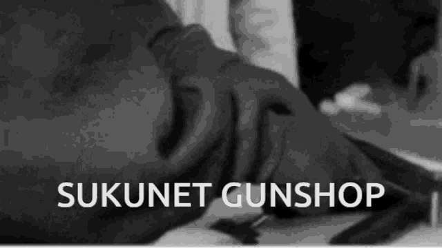 a black and white photo with the words sukunet gunshop in white