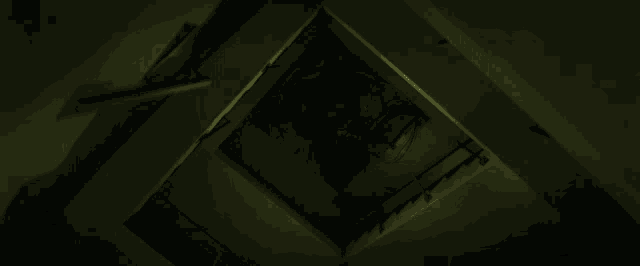 a snake is crawling through a dark room with a sign on the wall that says ' snake ' on it