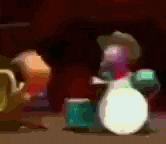 a blurry picture of a person playing drums in a dark room .
