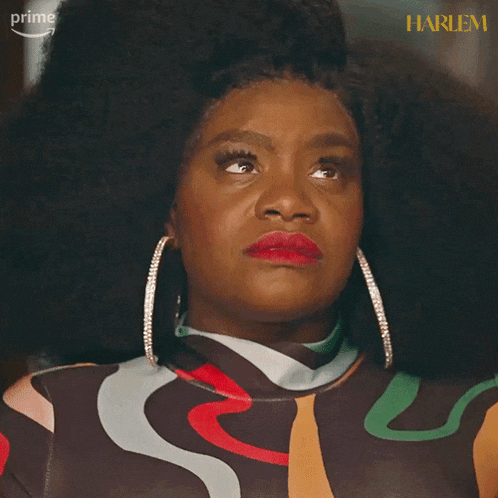 a close up of a woman 's face with the words harlem on the bottom