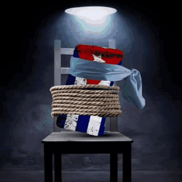 a chair with a flag tied to it with rope