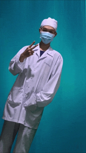 a man wearing a white lab coat and a mask stands in front of a blue background that says he lo ne !!