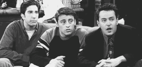 three men are sitting next to each other on a couch and making funny faces .