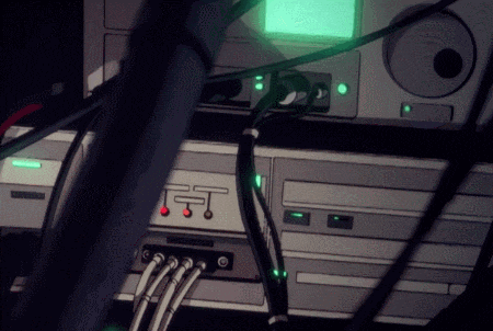 a bunch of wires are connected to a device with a green light on it