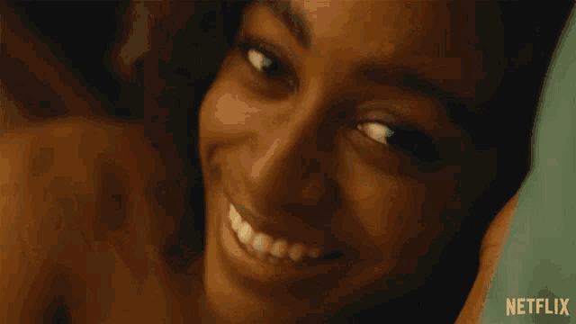 a close up of a woman 's face with netflix written on the bottom right