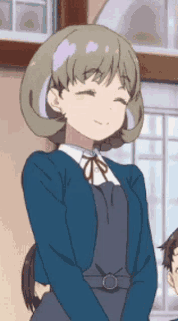 a girl in a blue sweater and overalls is smiling .